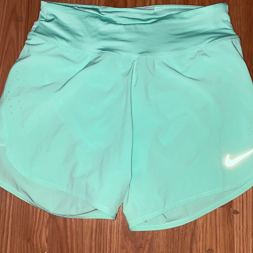 Gorgeous Nike mint color, size small running shorts